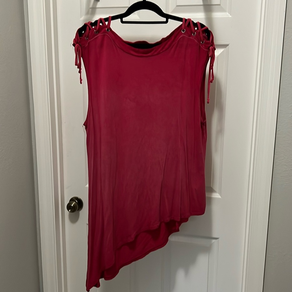 Red shirt with lace up shoulder detail and Asymmetrical hem